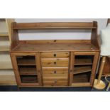 A pine sideboard fitted with four drawers