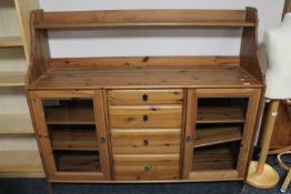 A pine sideboard fitted with four drawers