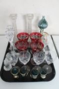 A tray of assorted glass ware : cranberry glass goblet, candlesticks,