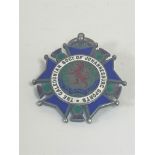 A silver and enamel medal for the Caledonian society of Johannesburg