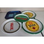 Ten vintage beer trays bearing advertising