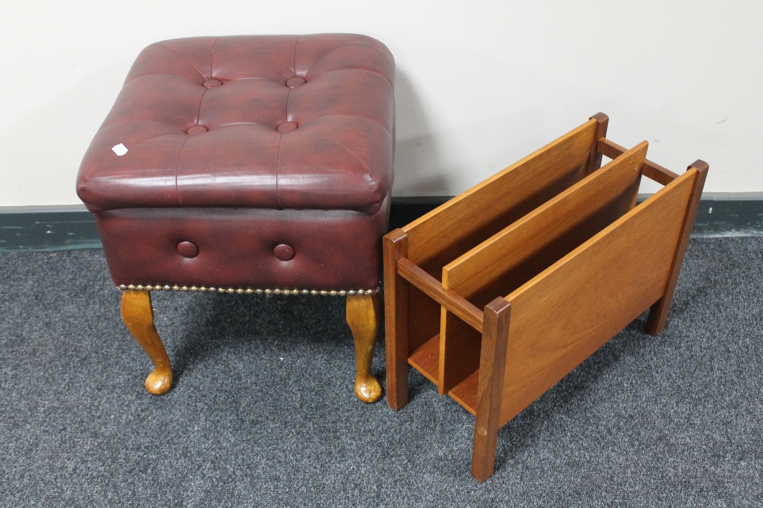 A mid 20th century vinyl upholstered storage footstool and a teak magazine rack