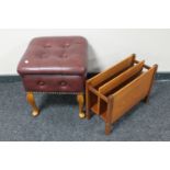 A mid 20th century vinyl upholstered storage footstool and a teak magazine rack