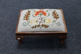 A mahogany tapestry footstool