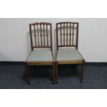 A pair of inlaid mahogany dining chairs