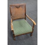 An early 20th century bergere backed armchair