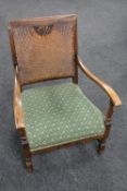 An early 20th century bergere backed armchair