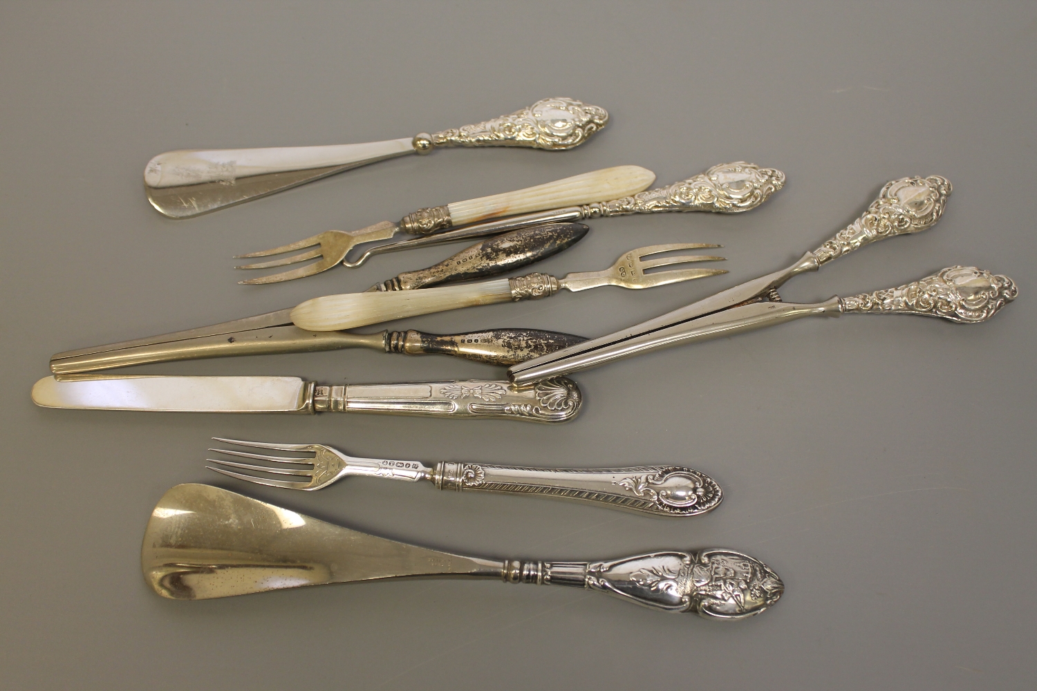 A group of silver including glove stretchers,