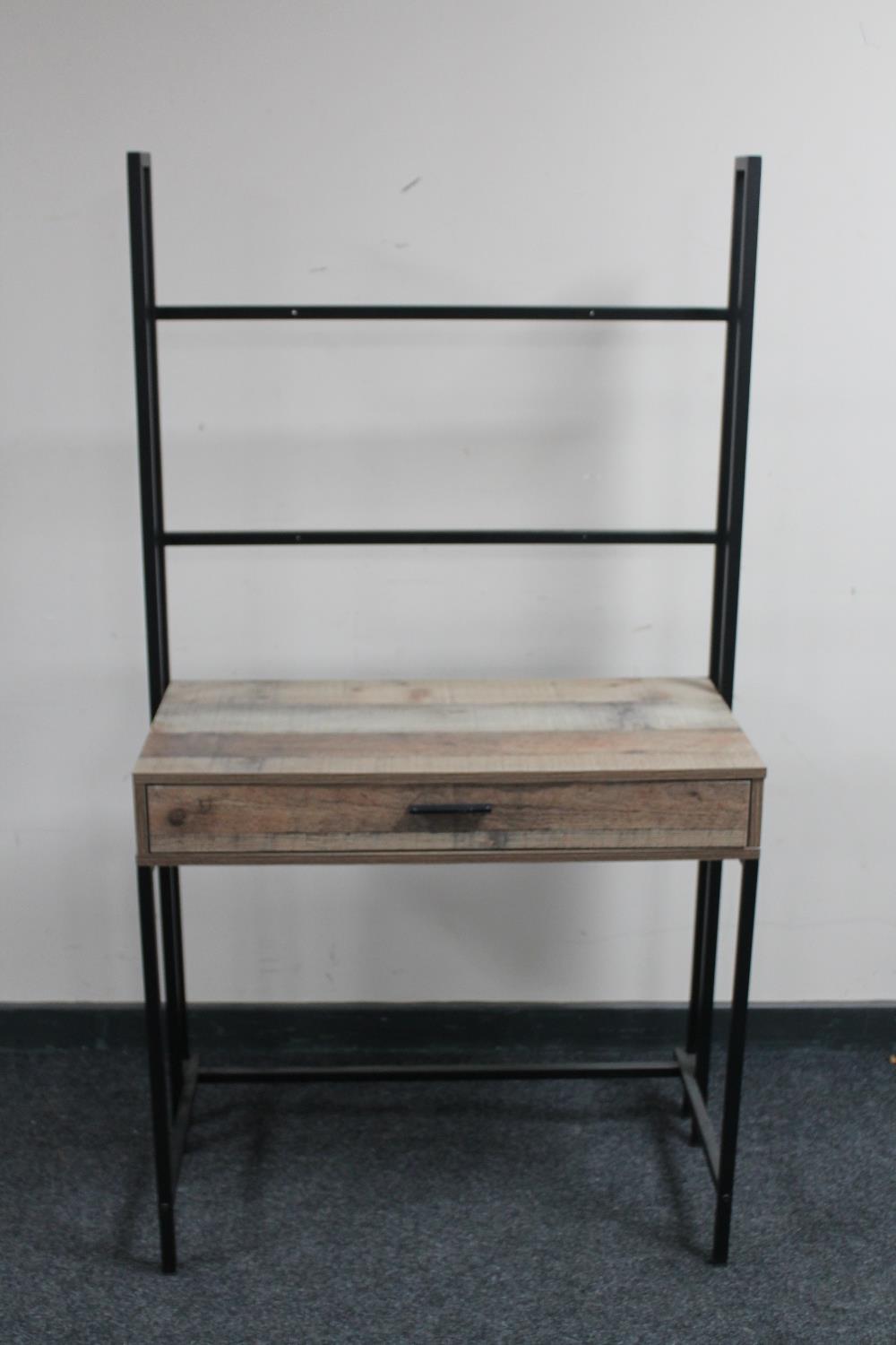 A contemporary metal framed dressing table fitted with a drawer