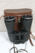 A set of leather cased Japanese Aloma field binoculars,