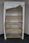 A pine canvas covered storage shelf