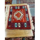 A fringed Caucasian mat,