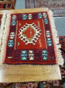 A fringed Caucasian mat,