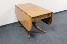 A Victorian mahogany pedestal Pembroke table