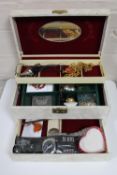 A jewellery box containing costume jewellery : necklaces, earrings, two gents wristwatches,