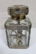 A presentation decanter with highly ornate silver mounts,