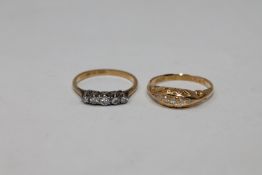 Two 18ct gold five stone diamond rings (2)