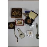 A box containing costume jewellery, gold plated cufflinks, cameo brooch,