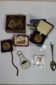 A box containing costume jewellery, gold plated cufflinks, cameo brooch,