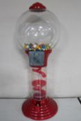 A coin operated gum ball machine