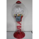 A coin operated gum ball machine