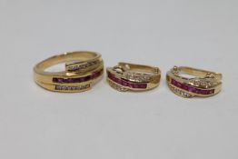 An 18ct gold diamond and ruby set ring, size R,