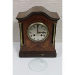 An Edwardian inlaid mahogany mantel clock with silvered dial and French movement