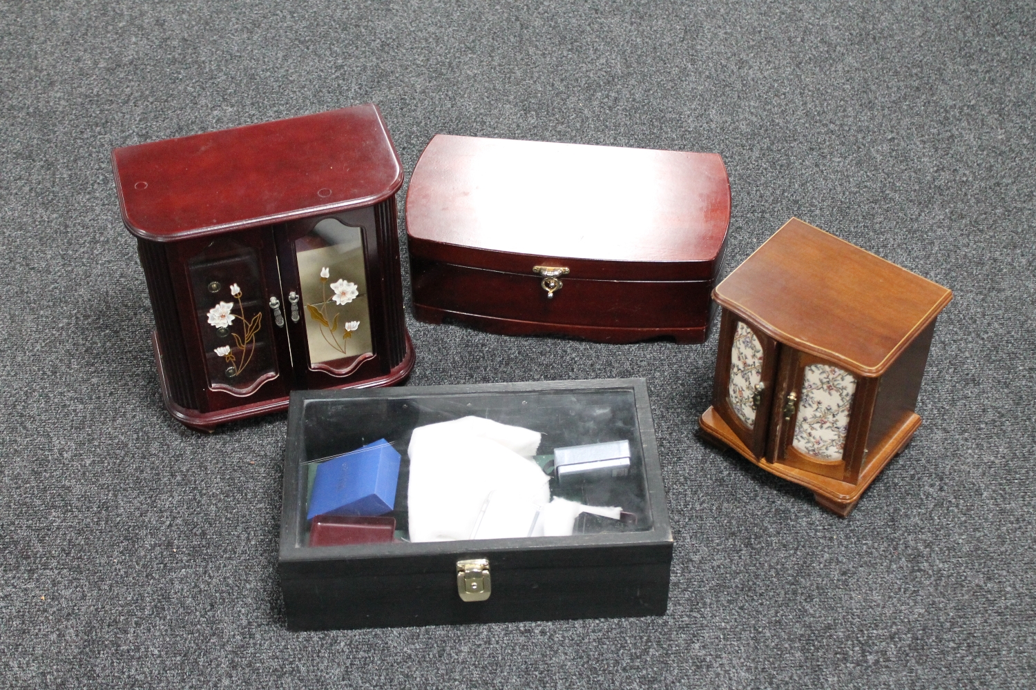 A crate of two jewellery boxes, three wooden jewellery box,