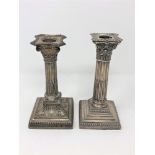 Two Victorian silver Corinthian column candlesticks,