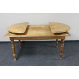 A pine flap ended dining table