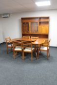 A reproduction mahogany dining room suite comprising of extending twin pedestal dining room table,