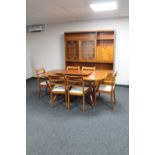 A reproduction mahogany dining room suite comprising of extending twin pedestal dining room table,