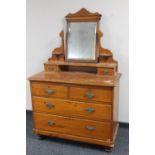 An antique pine dressing chest