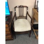 An Edwardian mahogany armchair,