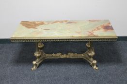 An ornate brass and onyx rectangular coffee table