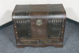 A contemporary leather bound travel trunk