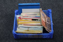 A box of assorted folded road maps, Bero cook books,