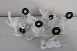 Six cast iron Michelin Men figures