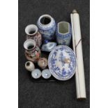 A tray of oriental wares including a scroll, blue and white lidded urn, hand fan, tureen,