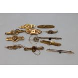 A good collection of 18ct and 15ct gold brooches CONDITION REPORT: 18ct - 3.3g.