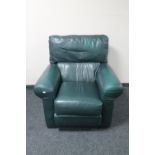 A turquoise leather armchair