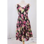 A box of twenty-four vintage flower v-neck dresses,