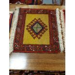 A fringed Caucasian mat,