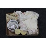 A box of lace table pieces, pair of candlesticks,