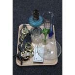A tray of antique oil lamp with blue glass reservoir, glass vases, boxed domino's,