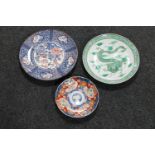 An Imari scalloped edge plate and two further Japanese plates