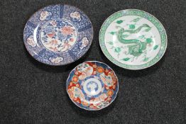 An Imari scalloped edge plate and two further Japanese plates