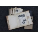 A box of antique journals containing paper, press cuttings,