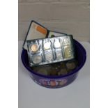 A plastic tub containing a quantity of British coins, pre decimal coins, Crowns,