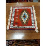 A fringed Caucasian mat,